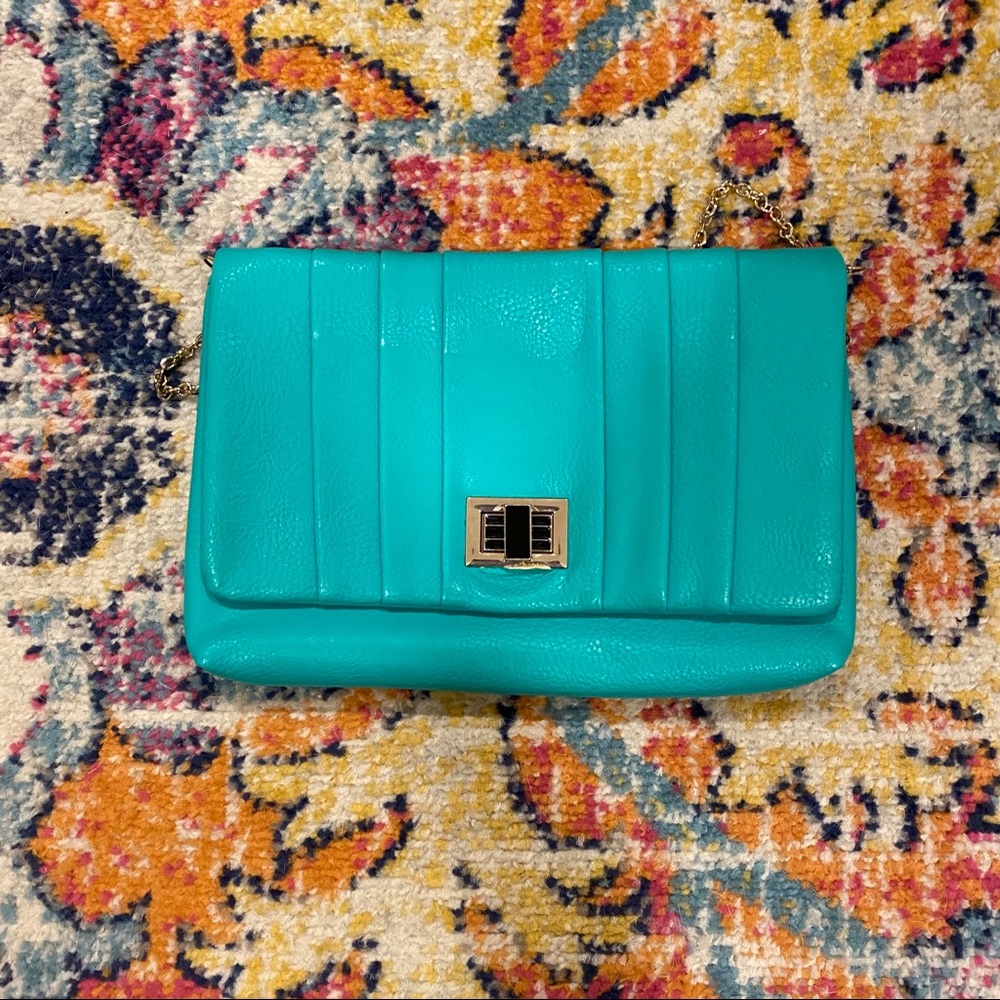 Vibrant, teal clutch with removable gold chain